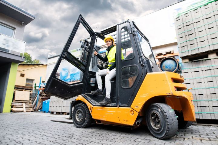 female-forklift-truck-driver-outside-a-warehouse-2024-10-18-17-18-53-utc.jpg